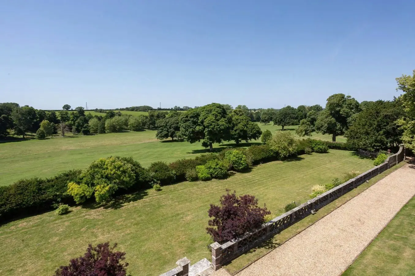 The gravel terrace walk and balustrade, with lawns and parkland beyond